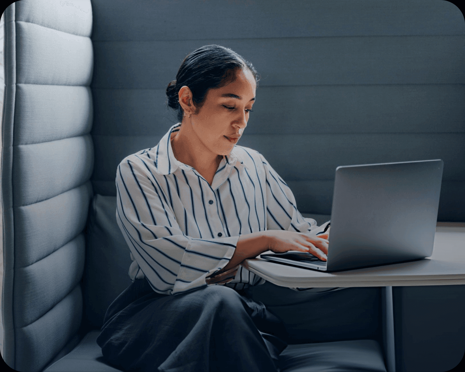 Consultant working on a laptop in a quiet workspace